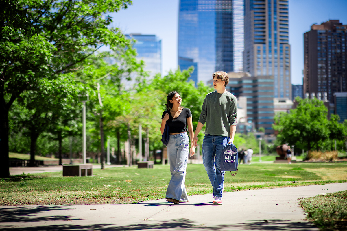 Two students walking on campus