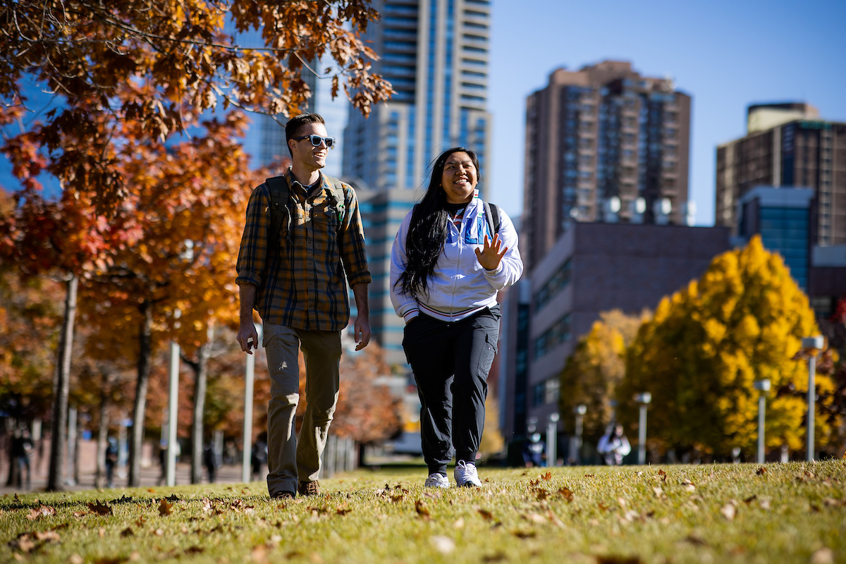 Two students walking on campus